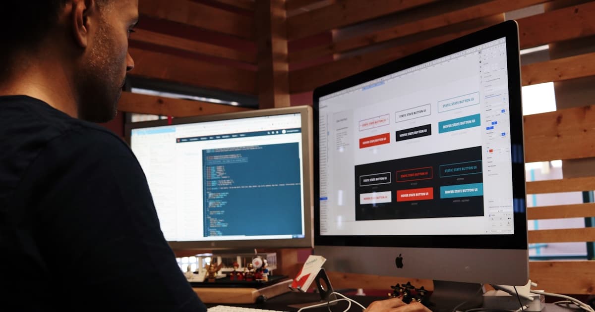 Person selecting images on a large monitor display